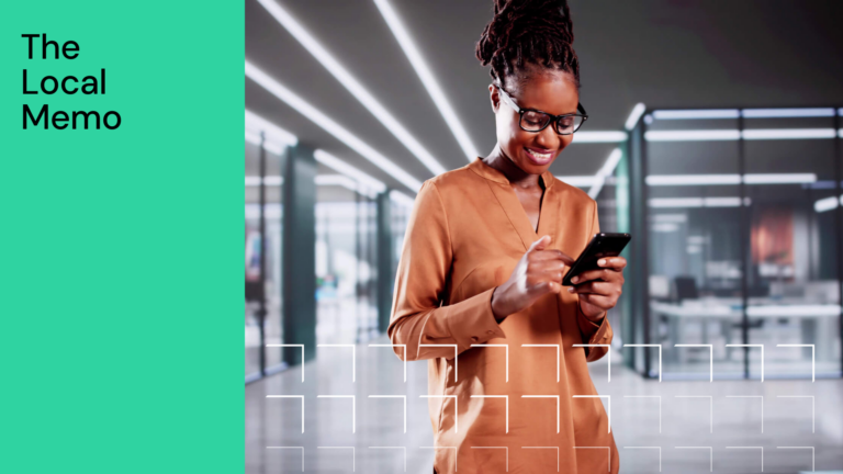 African-American Woman Professional Using Smartphone In Office As A Customer Service Representative Browsing New App For Sales Management.