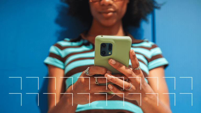 Woman using social media on her smartphone, illustrating how social media content influences local search rankings.