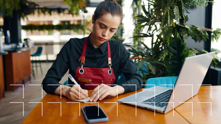 woman restaurant worker at a table with a notepad