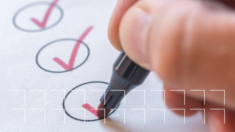 Close-up image of a pen in hand checking boxes on paper